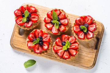 Strawberry tart on white. Summer dessert with berries