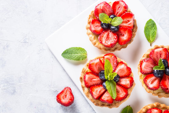 Strawberry tart on white table. Top view.