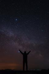 Man on the background of the milky way