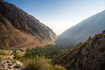 Dry dusty trail zig zagging up a desert mountain in California