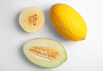 Flat lay composition with melons on white background