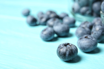 Juicy and fresh blueberries on wooden table, closeup