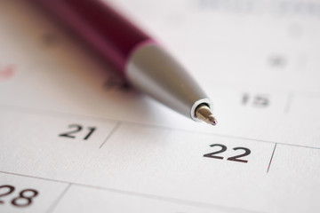 Calendar page with pen point at 22nd date