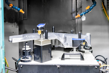 High precision CNC machining center working, operator machining automotive sample part process in factory