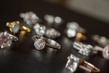 Jewelry diamond rings set on black background close up