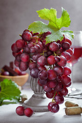 Ripe grape bunch  with leaves and glass of wine. Still life concept - 221863188