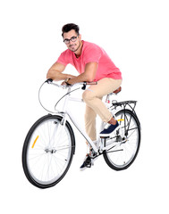 Fototapeta na wymiar Handsome young hipster man with bicycle on white background