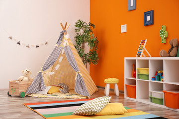 Cozy kids room interior with play tent and toys © New Africa