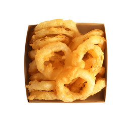 Delicious golden breaded and deep fried crispy onion rings in cardboard box on white background, top view