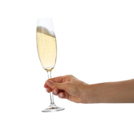 Woman holding glass of champagne on white background