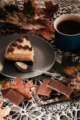 slice of cake with tea in autumn in the park