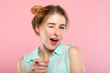 emotion expression. smiling woman pleased with herself. young beautiful girl winking. portrait on...