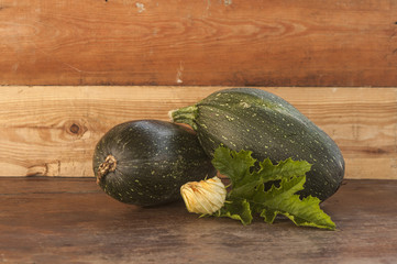 raw zucchini on wooden table