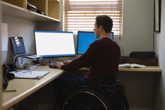 Disabled man working on computer