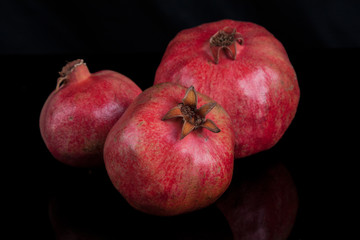 Fototapeta na wymiar pomegranates on a black background