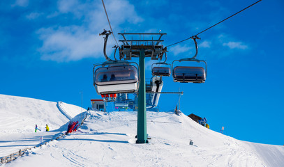 Fototapeta na wymiar Alpine ski chairlift