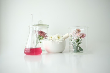cosmetic skincare beauty product .natural organic flower oil ingredient in the laboratory. packaging spa concept.