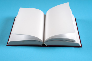 Open book on bright colorful background. Back to school. Copy space for text.