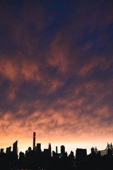 Fototapeta na wymiar Skyline silhouette New York City Manhattan sunset golden hour USA