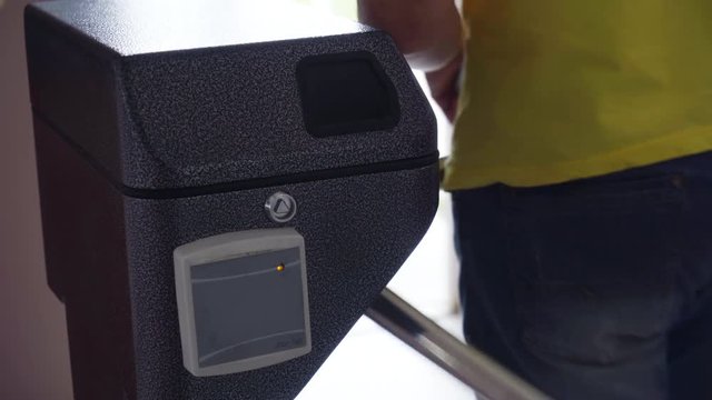 office entrance turnstile with check-in card. Security barrier