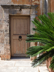 Old door in streets of Crete, Greece