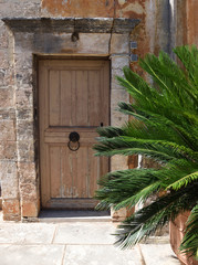 Fototapeta na wymiar Old door in streets of Crete, Greece