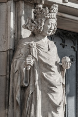 Wall figure of queen at main façade of cathedral in Magdeburg, Germany