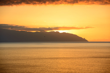 Naklejka premium Sunset in the clouds over Gomera Island, Tenerife, Canary, Spain.