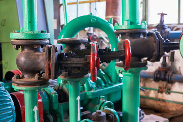 Several old valves on the cold water pipeline.