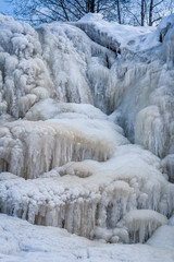 Frozen cascade of waterfall. Winter background. Jagala Waterfall, Estonia.  Close-up.