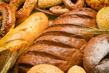 Fresh bread and bakery in the form of background, close-up and with selective focus