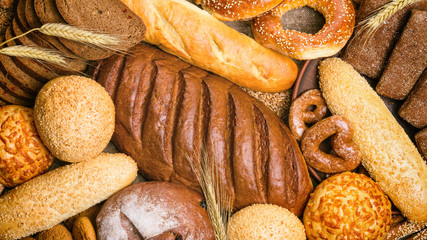 Fresh bread and bakery in the form of background, top view, close-up