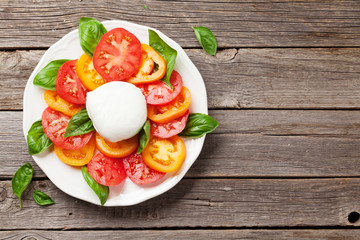 Caprese salad with tomatoes, basil and mozzarella