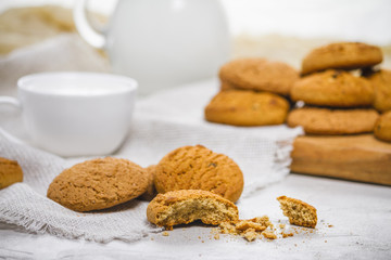 Fresh delicious oatmeal cookies and milk for breakfast, selective focus, close-up