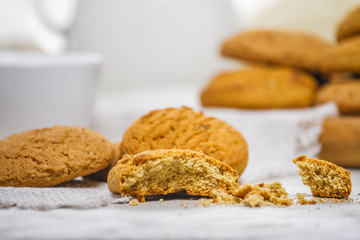 Fresh delicious oatmeal cookies and milk for breakfast, selective focus, close-up