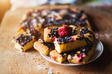 Close-up of pieces of delicious fresh homemade berry pie in a bowl
