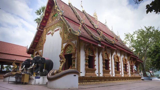 Timelaps of thai temple  at afternoon time with moving of buddhism, location at wat phuket , Pua , Nan , Thailand 
