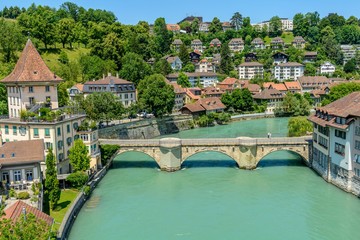 Bern downtown city aerial cityscape or skyline with light green river during summer with old buildings.