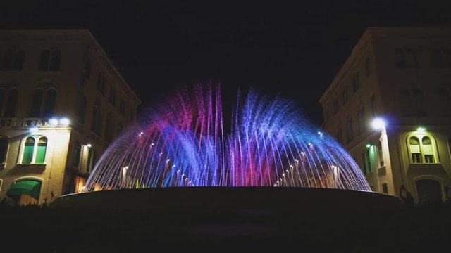 Fountain in front of Republic square in Split at night.