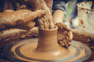 Hands of a potter at work
