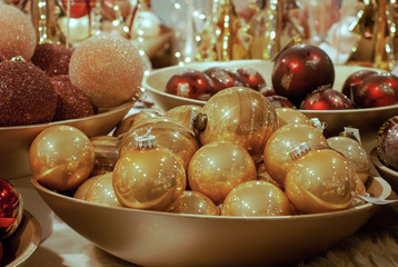 Christmas decoration ball : Red and Gold Color of Christmas balls in bowl . Decoration for Christmas and New Year Holiday party.Festive, lights background