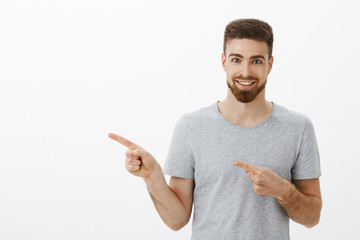 Waist-up shot of enthusiastic and charismatic handsome sportsman with beard and white pleasant...