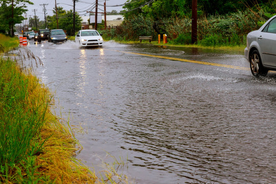 Cars on the street flooded with rain
