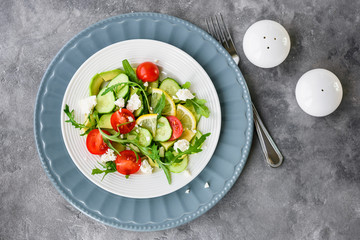 Salad with vegetables and cheese.