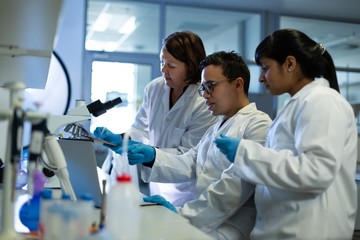 Team of scientists experimenting together