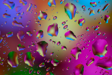 Fototapeta na wymiar a lot of colorfull drops on window