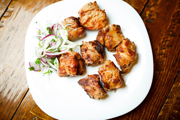 Appetizing, tasty shish kebab in the white plate