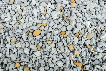 Gravel with white and yellow pebbles/texture background