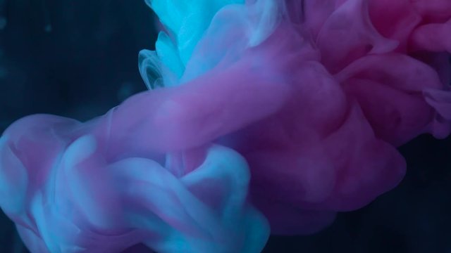 Color drop underwater creating a silk drapery. Ink swirling underwater