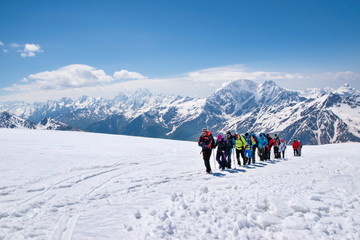 A group of tourists goes to conquer the summit